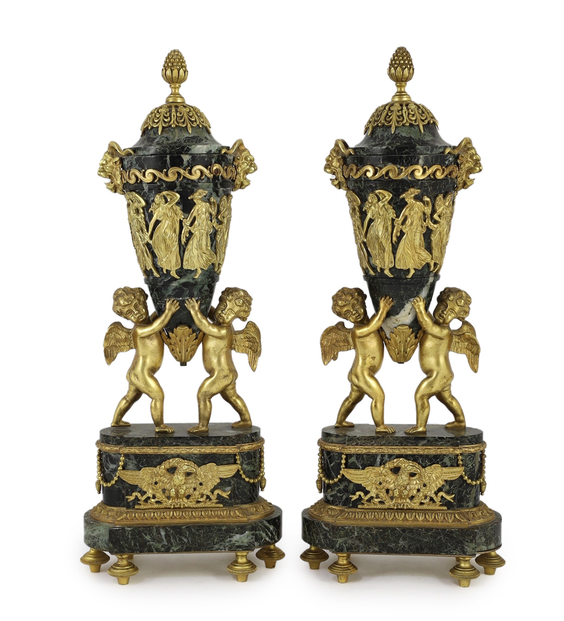 A pair of Louis XVI style ormolu mounted green marble urns Height 41cm.